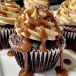 Delicious Salted Caramel Chocolate Cupcakes topped with salted caramel drizzle and sprinkles.