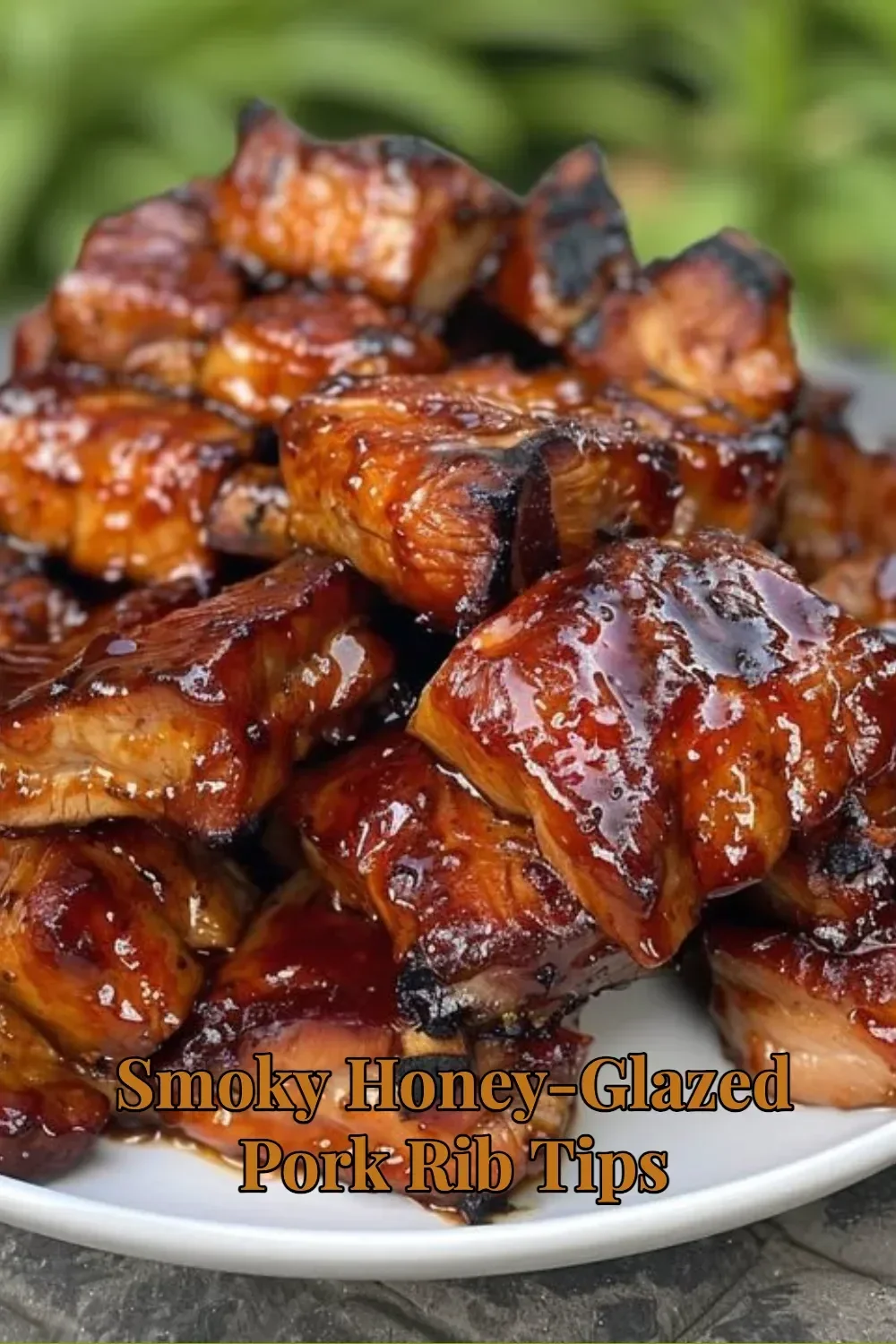 Smoky honey-glazed pork rib tips cooked to perfection on a grill