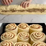 Soft cinnamon-walnut rolls with creamy cream cheese frosting