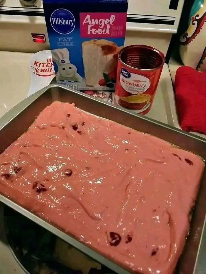 Slice of Strawberry Angel Cake with fresh strawberries on top