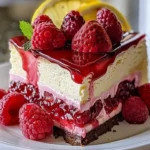 Delicious strawberry lemonade cheesecake with fresh strawberries and lemon zest.