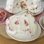 Delicious strawberry shortcake dessert topped with fresh strawberries and cream