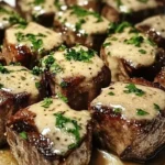 Tender steak bites served in garlic butter with creamy Parmesan sauce