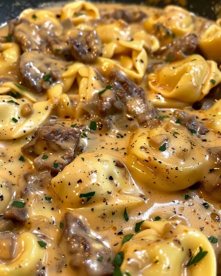 Delicious cheesesteak tortellini in creamy provolone sauce