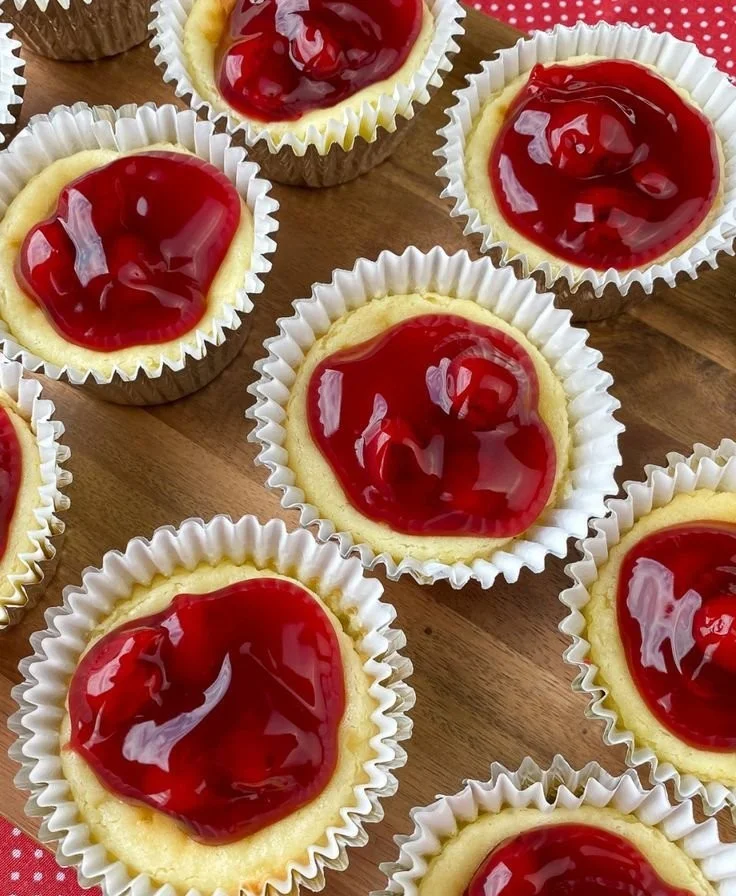 Delicious cherry cheesecake cupcakes topped with cherries and cream cheese frosting