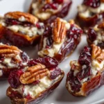 Cranberry pecan cream cheese-stuffed dates on a serving platter