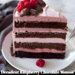 Decadent raspberry chocolate mousse cake with rich chocolate layers and fresh raspberries