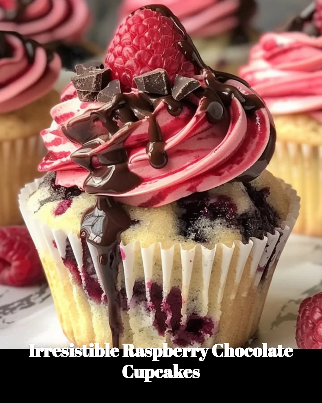 Delicious raspberry chocolate cupcakes decorated with fresh raspberries and chocolate frosting.