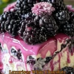 Luxurious white chocolate blackberry poke cake with fresh blackberries and drizzled chocolate