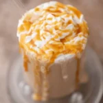 Delicious McDonald's Caramel Frappe with whipped cream and caramel drizzle
