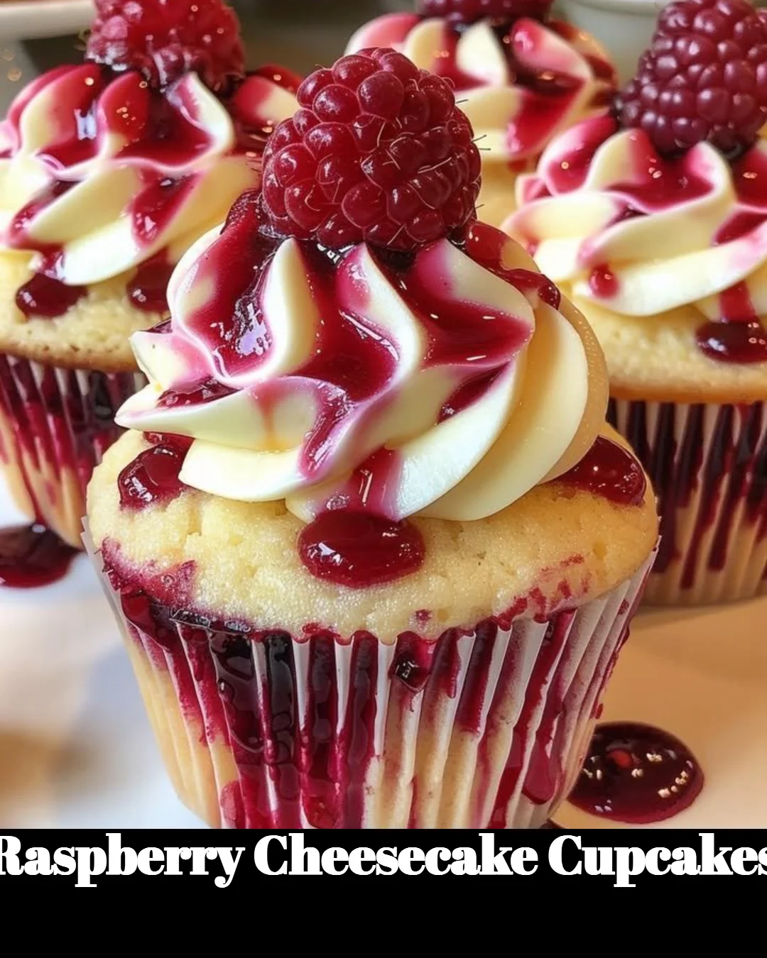 Delicious Raspberry Cheesecake Cupcakes topped with fresh raspberries