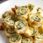 Delicious spinach dip pinwheels on a serving platter