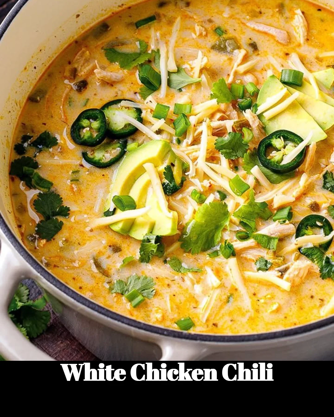 Delicious bowl of White Chicken Chili garnished with cilantro and lime