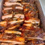 Tender air fryer dry-rub ribs served on a plate with barbecue sauce