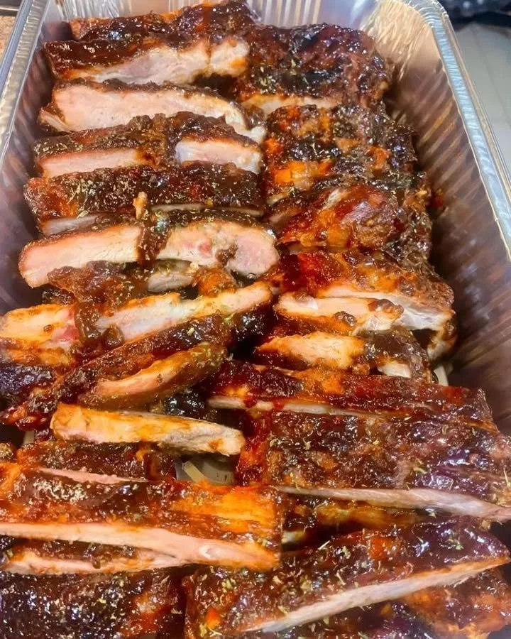 Tender air fryer dry-rub ribs served on a plate with barbecue sauce