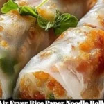 Crispy air fryer rice paper noodle rolls served with dipping sauce.