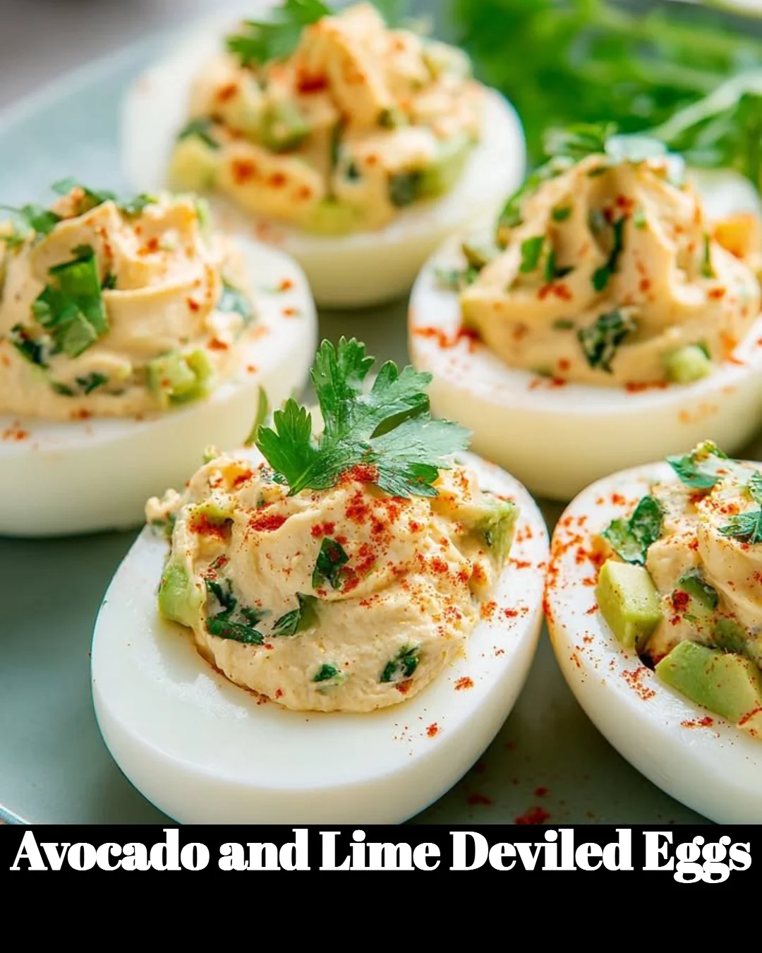 Avocado and Lime Deviled Eggs served on a platter, garnished with lime wedges.