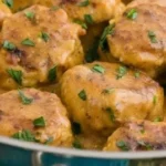 Delicious chicken meatballs in creamy sauce served on a plate