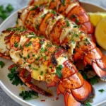 Delicious cowboy butter lobster tails recipe served on a plate.