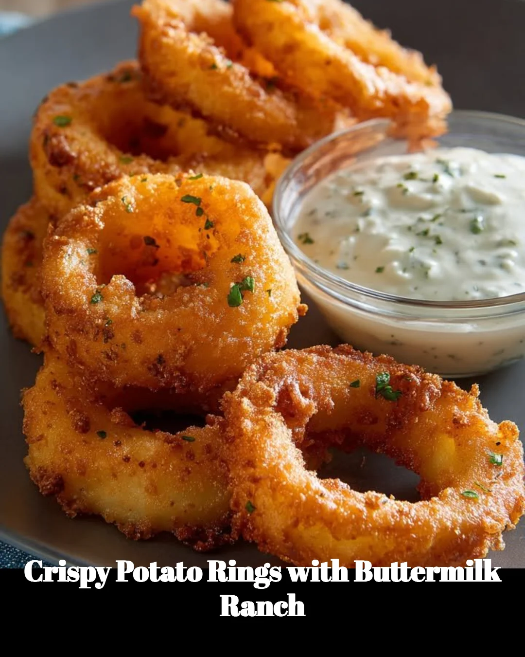 Crispy potato rings with buttermilk ranch dip on a plate