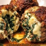 Delicious spinach mozzarella meatballs served on a plate.