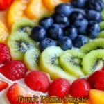 Delicious fruit pizza sugar cookie topped with fresh fruits and cream