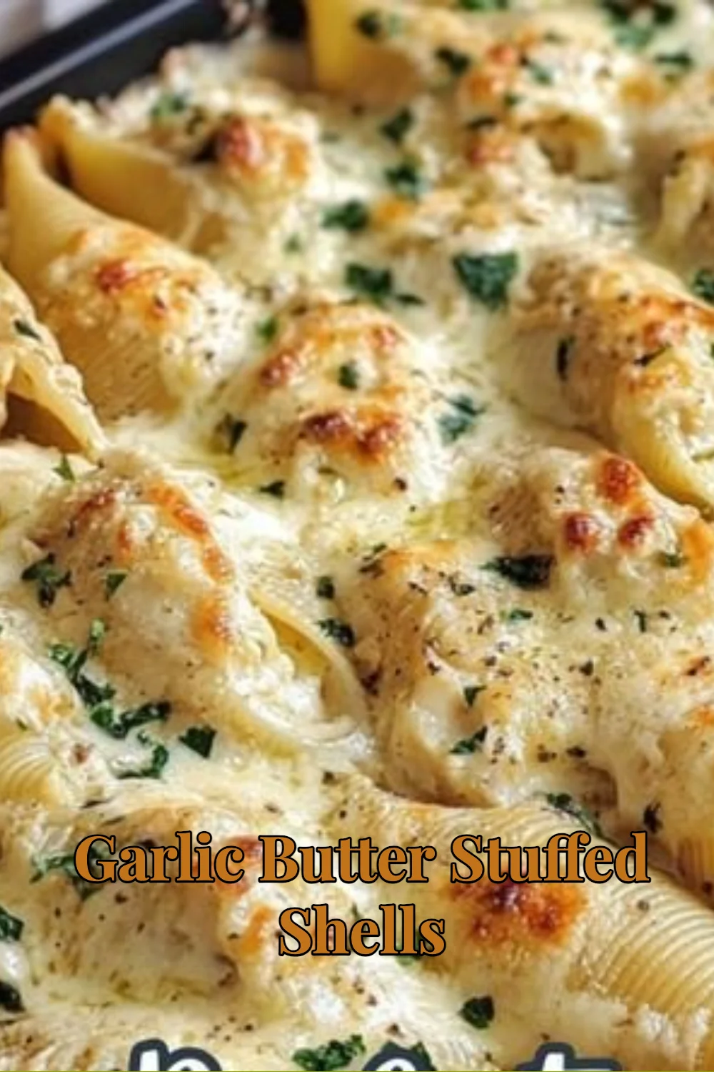 Delicious Garlic Butter Stuffed Shells served in a white dish, garnished with parsley.