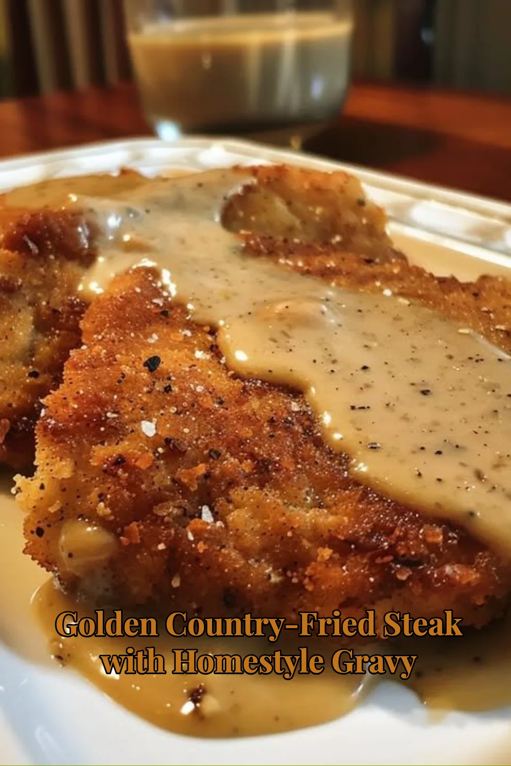 Golden Country-Fried Steak served with homestyle gravy on a plate