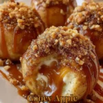 Delicious gooey apple caramel bombs served on a plate with caramel drizzle