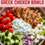 Colorful Greek Chicken Bowls with fresh vegetables and herbs, showcasing Mediterranean cuisine.