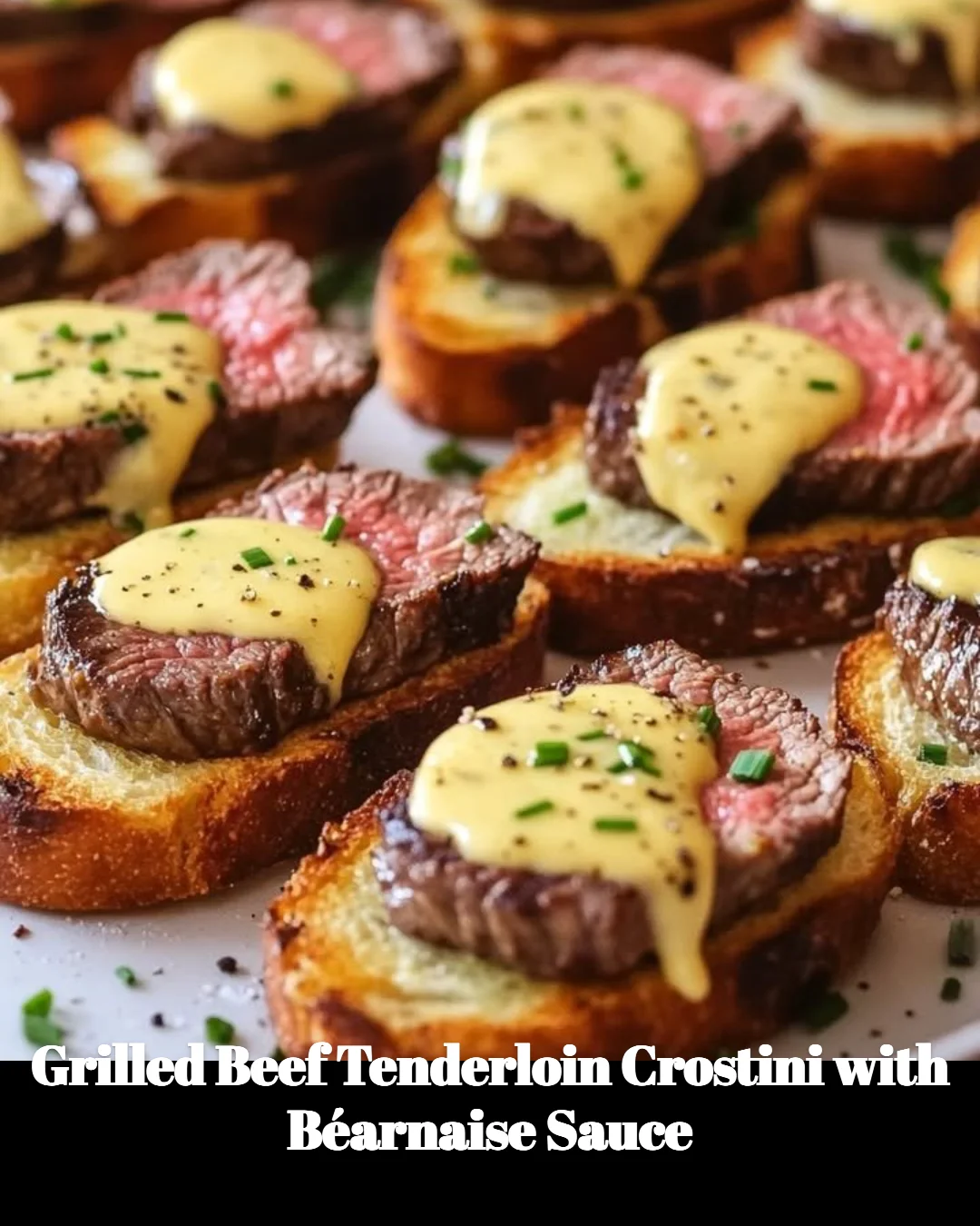 Grilled beef tenderloin crostini with béarnaise sauce on a platter