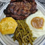 Delicious grilled steak served with mashed potatoes and creamy gravy