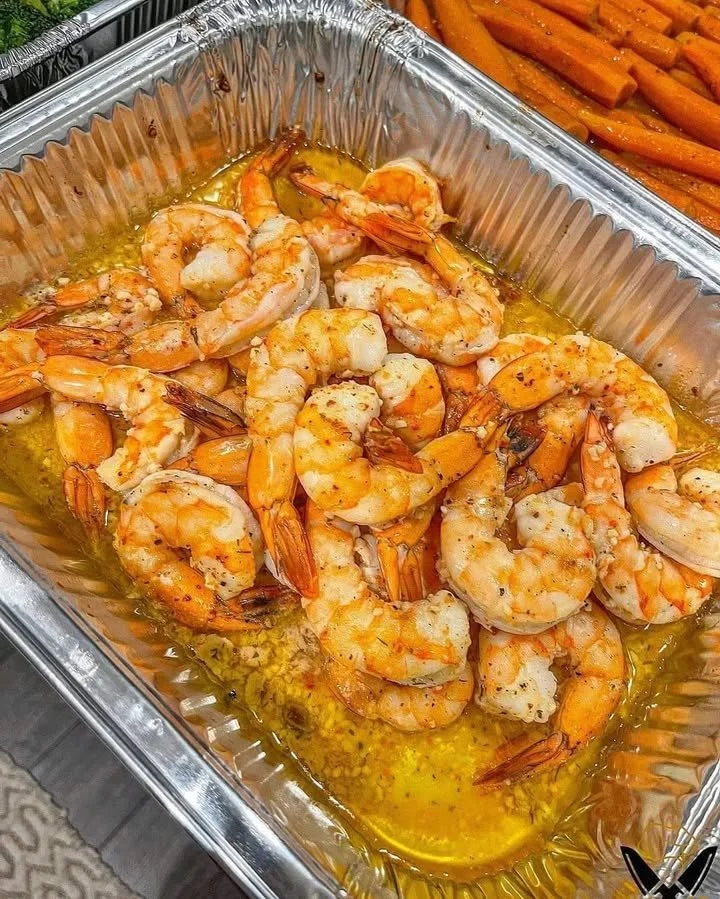 Delicious Henny Butter Shrimp served with herbs and spices.