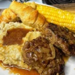 Homemade Salisbury steak with rich gravy and sautéed vegetables