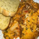 Meaty and cheesy lasagna layered with rich sauce and melted cheese