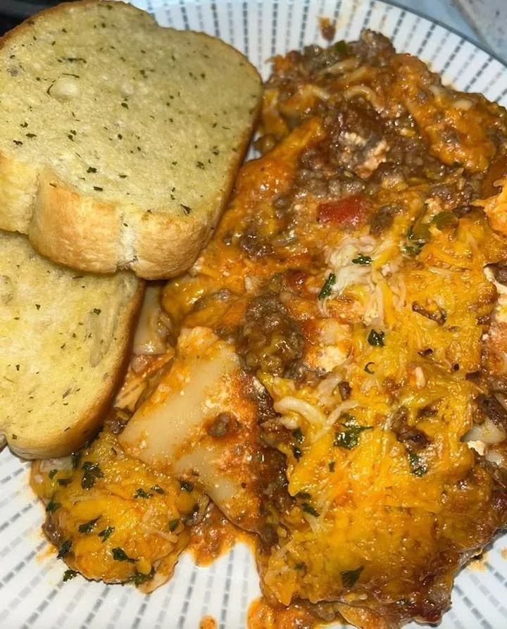 Meaty and cheesy lasagna layered with rich sauce and melted cheese