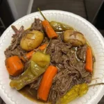 Delicious Mississippi Pot Roast served with vegetables and gravy