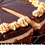 Delicious no bake peanut butter cheesecake topped with chocolate and peanuts