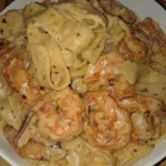 One-Pan Shrimp Fettuccine Alfredo served with herbs and parmesan