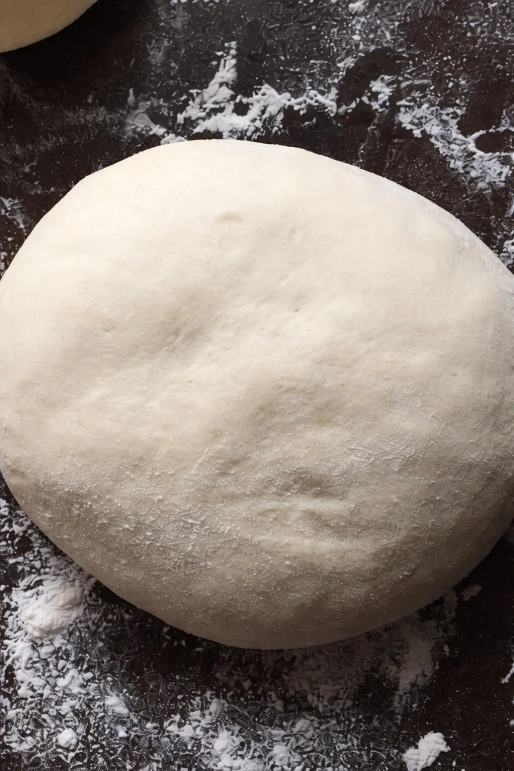 An image of fresh pizza dough ready to be shaped and baked.
