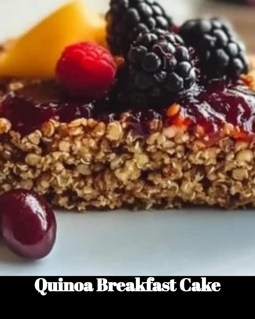 Delicious quinoa breakfast cake topped with fresh berries and nuts