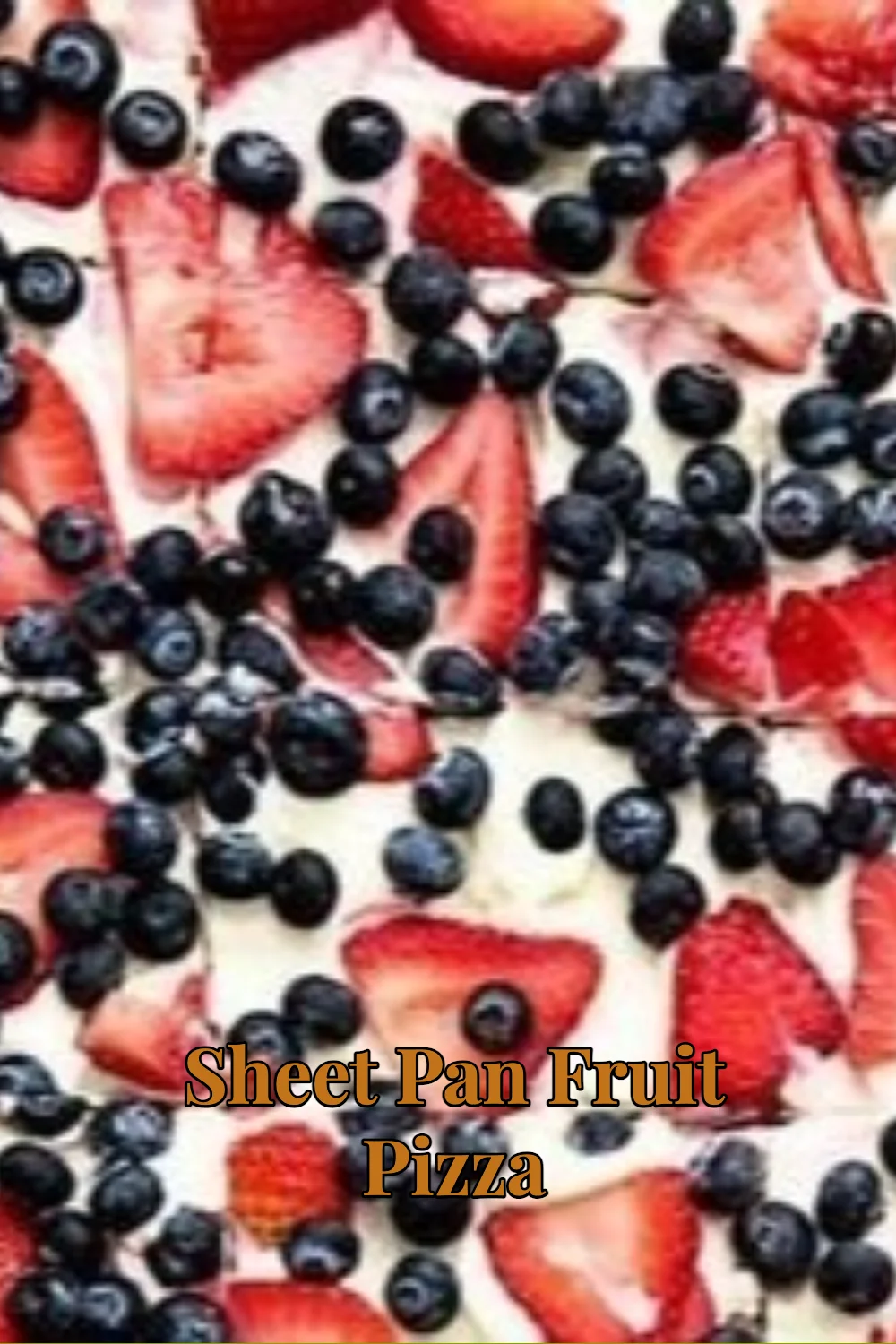 Sheet pan fruit pizza topped with colorful fresh fruits and cream cheese frosting
