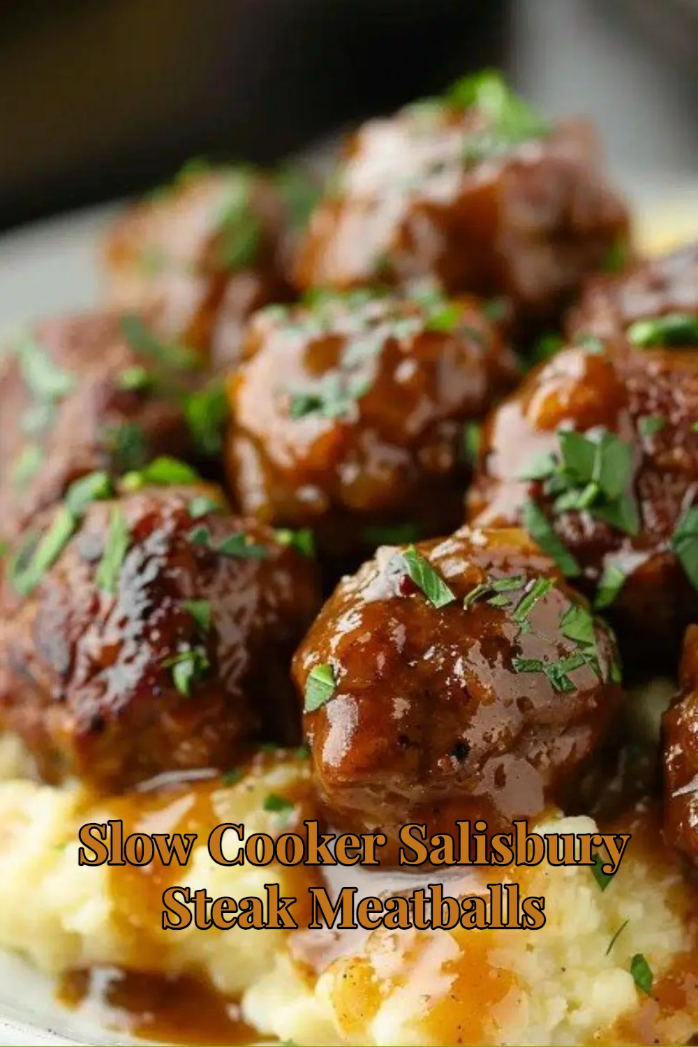 Slow Cooker Salisbury Steak Meatballs served with gravy and mashed potatoes