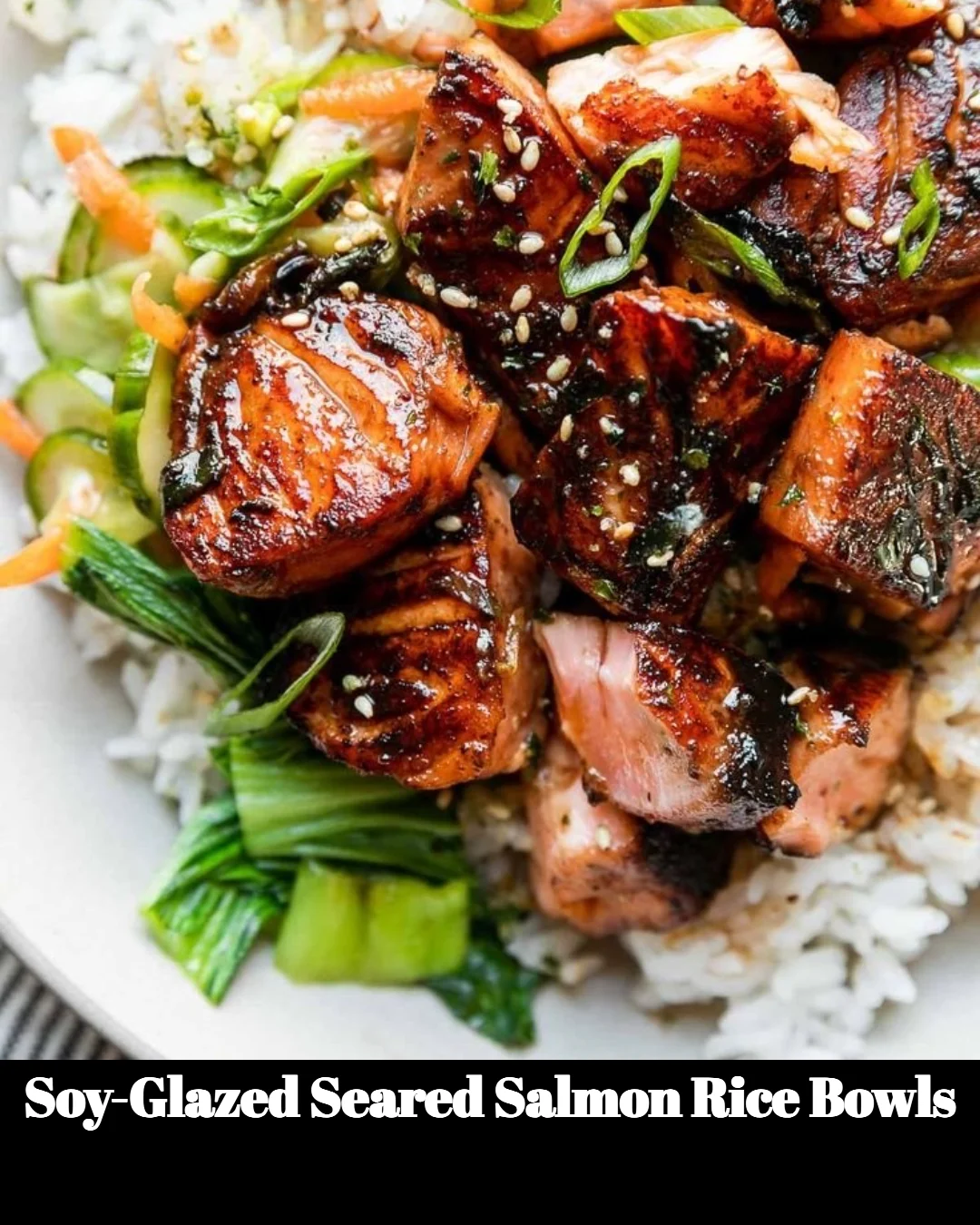 Delicious soy-glazed seared salmon rice bowl topped with fresh vegetables.