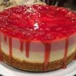 Strawberry and White Chocolate Mousse Cake with fresh strawberries on top.
