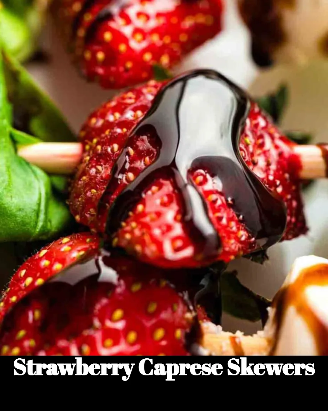 Plate of Strawberry Caprese Skewers with fresh basil and mozzarella