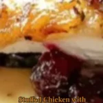 Stuffed chicken breast with spinach and cranberries served on a plate