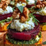 Sweet potato stacks with beet, pesto, and burrata topped with walnuts.