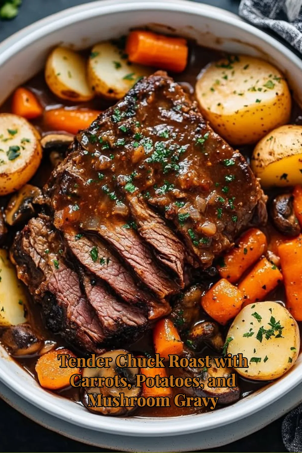 Tender chuck roast with carrots, potatoes, and mushroom gravy on a plate