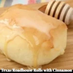 Texas Roadhouse Rolls served with cinnamon honey spread on a plate